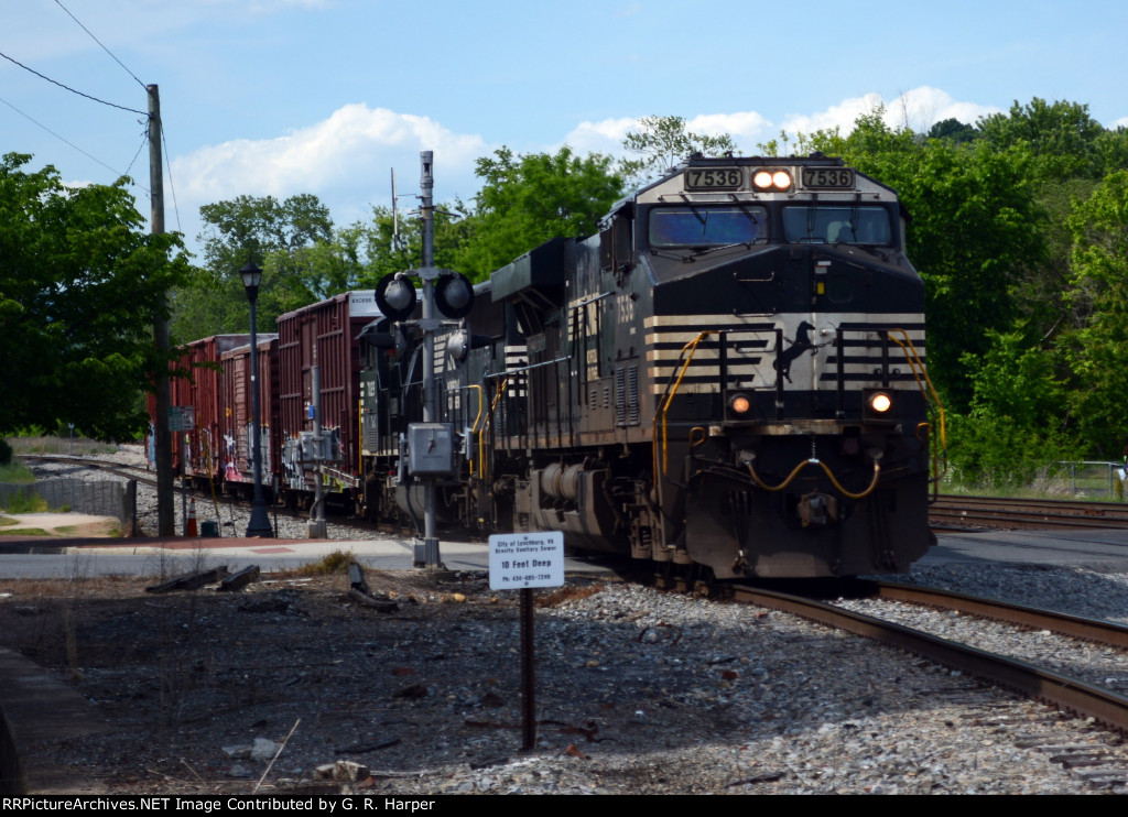 NS yard job E19 seen earlier in this album with cars FOR CSX now returns with cars FROM CSX.  Crossing Washington St. headed back to Montview Yard